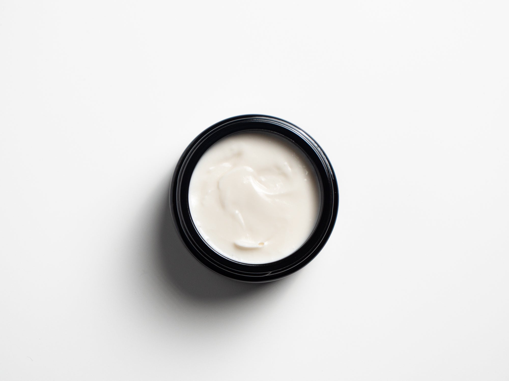 Open jar of Helichrysum FACE CREAM 24h viewed from above
