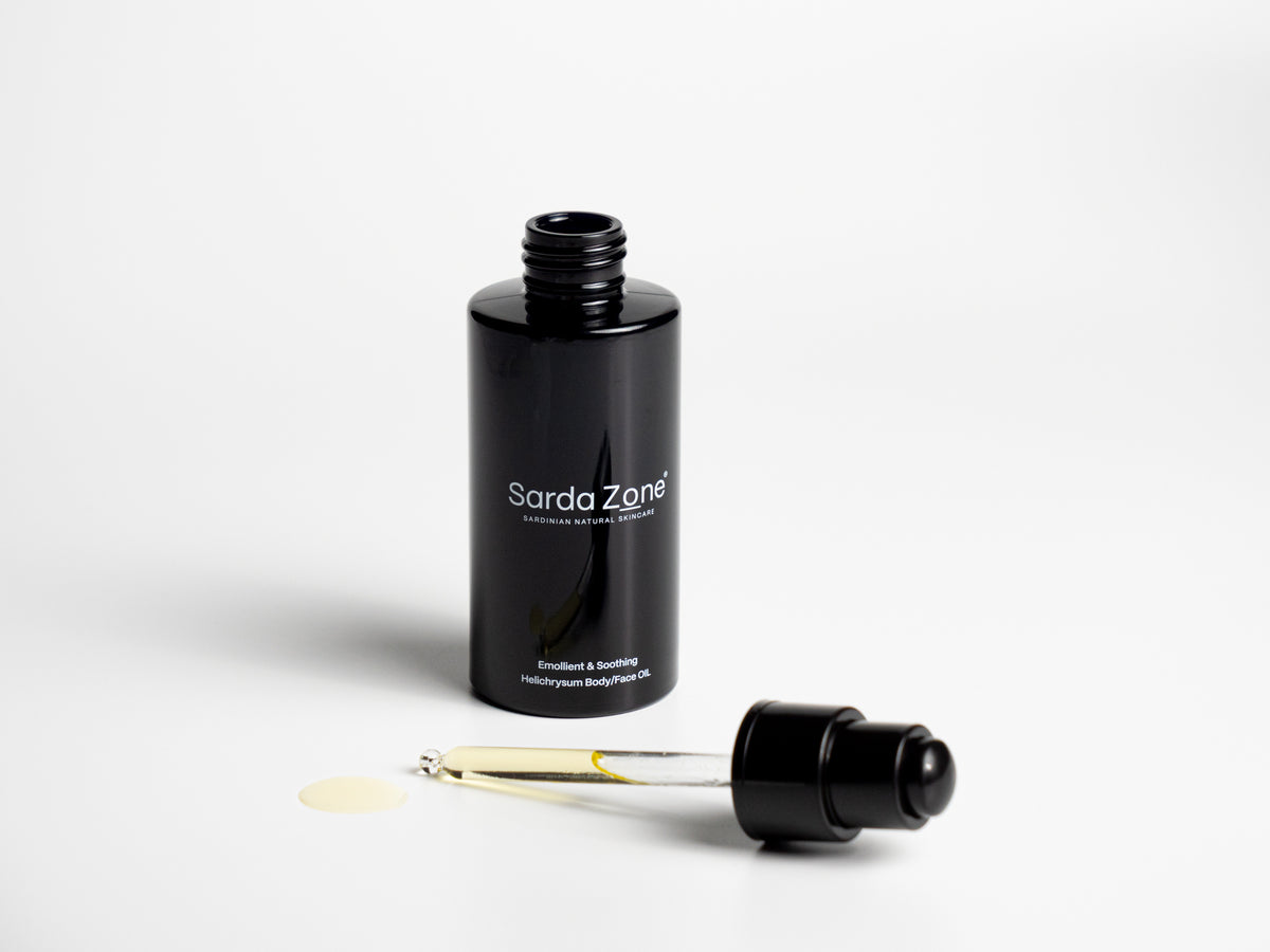 Open bottle of Sarda Zone Helichrysum Body/Face OIL with the dropper beside it